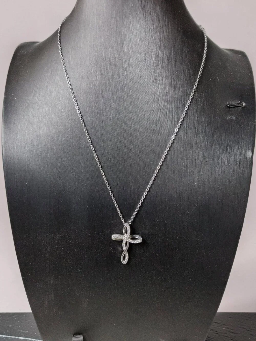 vintage Chrystal lined spiraled curled cross on a .925 sterling necklace